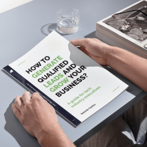 Image showing man holding guide to Lead Generation for tech company executives in his hands